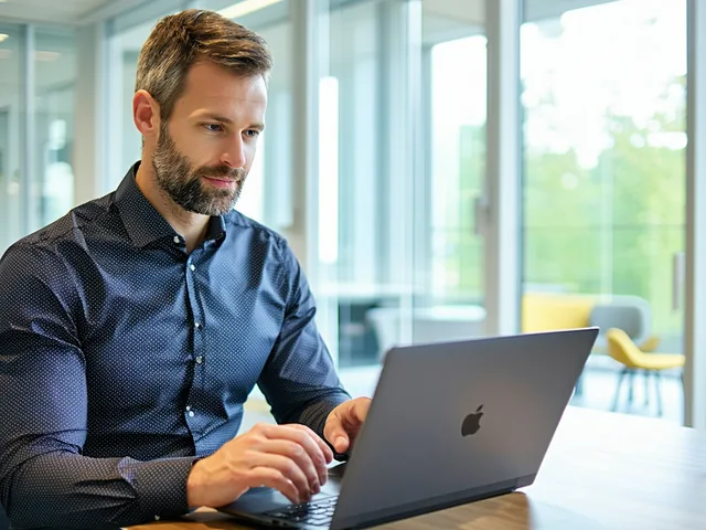 CFO reviewing a board presentation on a laptop in a modern office